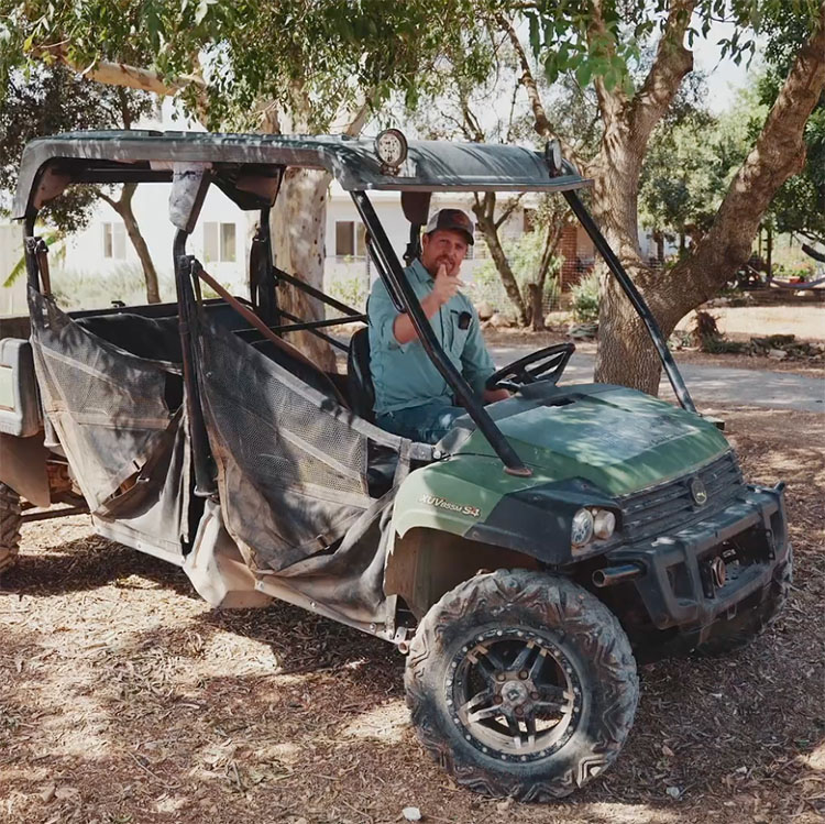 Joshua Waller in four-wheel drive ATV smiling and welcoming new subscribers